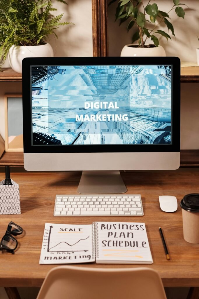 pexels-photo-6476808-6476808 Contemporary office setup featuring digital marketing strategy on a computer screen, ideal for business technology themes.
